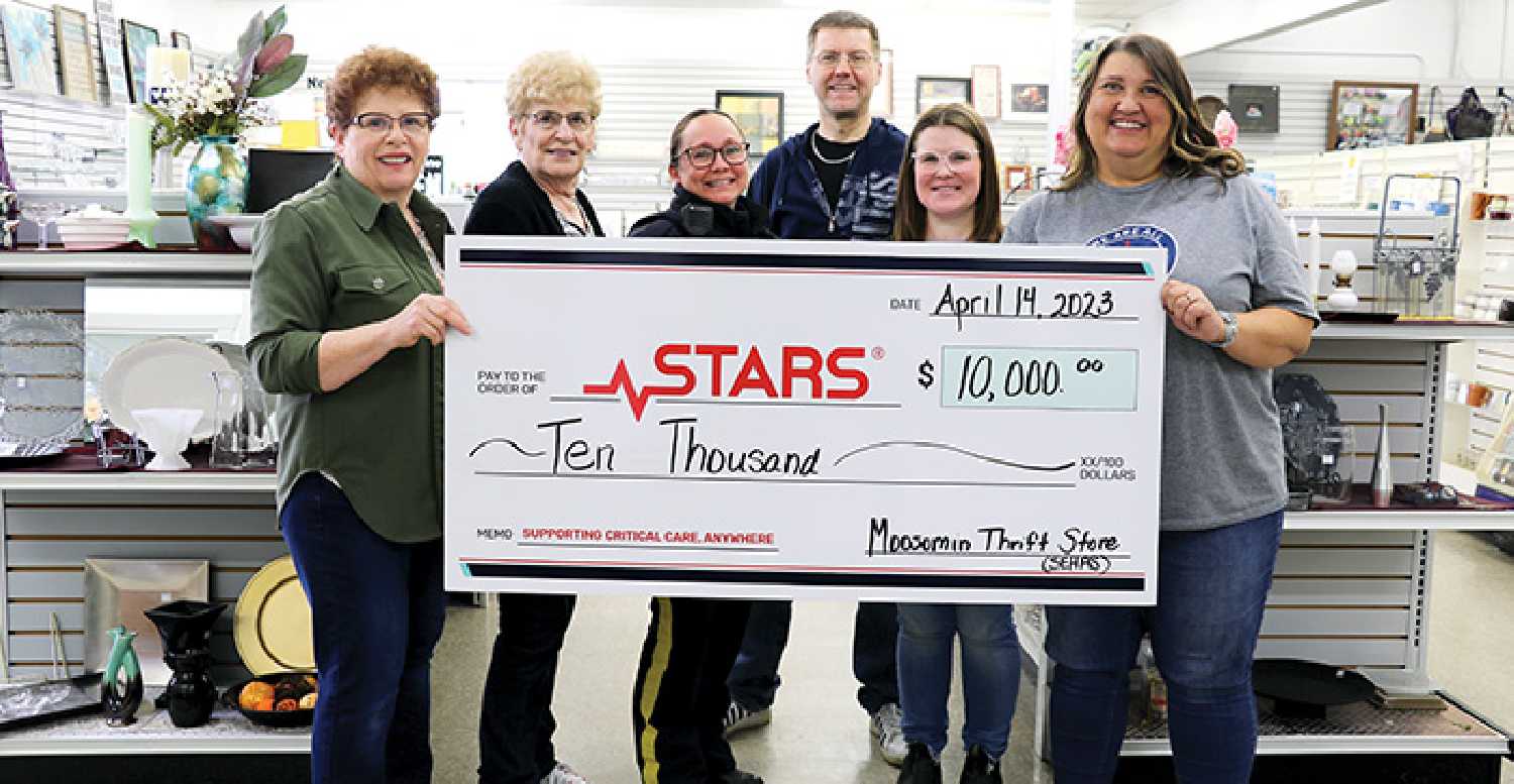 From left are Lori Shepherd, Marilyn Klinger, Trina Brace, Jonathan Pearce, and Samantha Campbell with the Moosomin Thrift Store making the donation to Kathy Skomar with STARS.